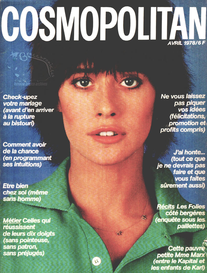 Cosmopolitan France magazine cover featuring a close-up portrait of model and actress Lorraine Bracco with a shag haircut, wearing a green collared shirt against a blue background with French text headlines.