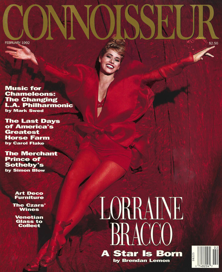 Cover of Connoisseur magazine featuring actress Lorraine Bracco in an all-red outfit, sitting with arms outstretched. Cover text reads "Lorraine Bracco: A Star Is Born by Brendan Lemon."