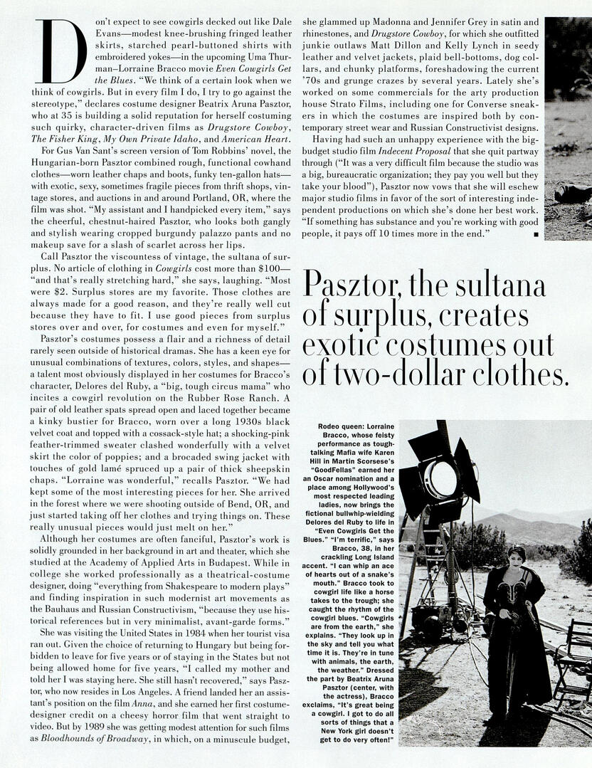 Magazine article spread about costume designer Beatrix Aruna Pasztor. Features text on "Even Cowgirls Get the Blues" and an inset black-and-white photo of actress Lorraine Bracco on a desert set next to a movie light.