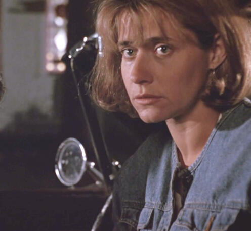 2 Lorraine Bracco as Bobbie sat in Virgil's car with serious expression in Talent for the Game.