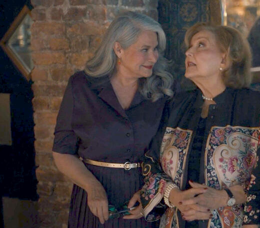 11 Lorraine Bracco standing beside Brenda Vaccaro in the Enoteca Maria in a scene from Nonnas.