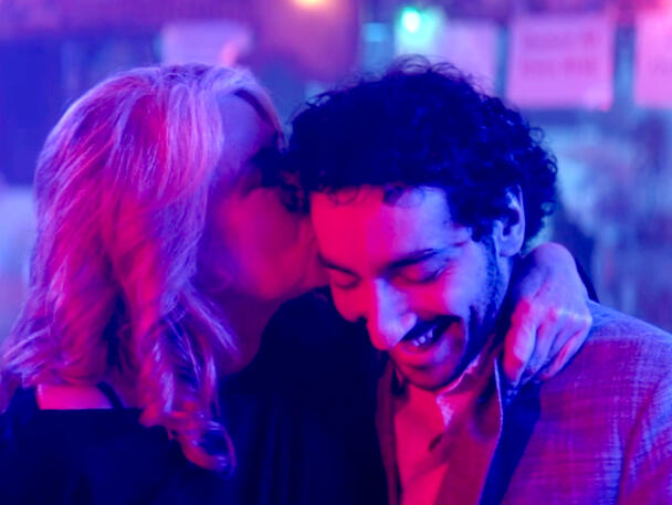 8 Lorraine Bracco kissing co-star Malek Rahbani under neon lights in Jacir.