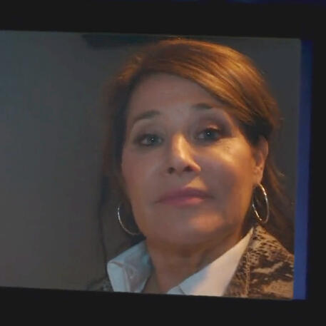 11 Lorraine Bracco in a corridor on a zoom call to her son from Jerk series.