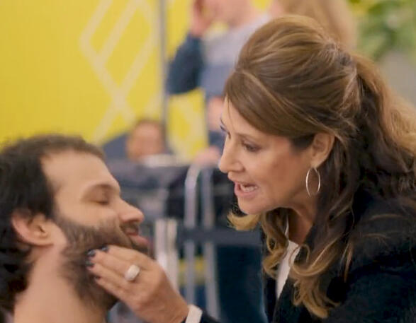 12 Lorraine Bracco squeezing Tim Renkow's face during a scene in Jerk.