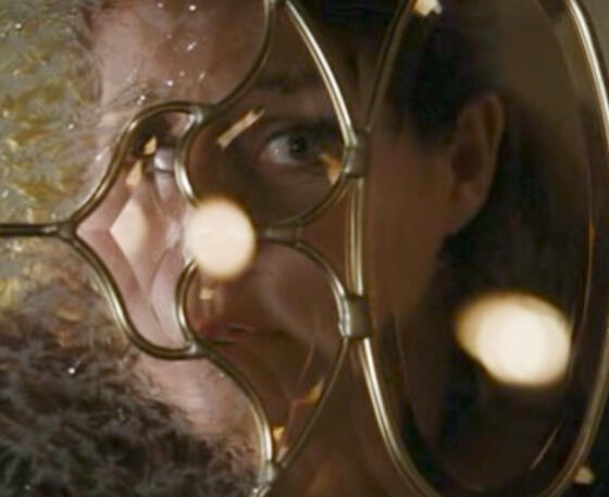 9 Extreme close-up of Lorraine Bracco peering through a winow, Son of Morning