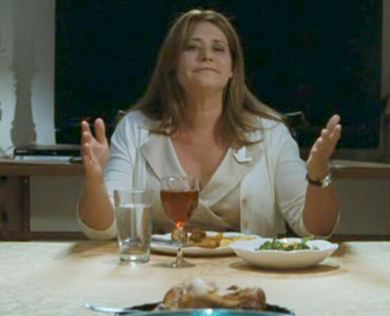 8 Lorraine Bracco arms open at dinner table scene from Son of Morning
