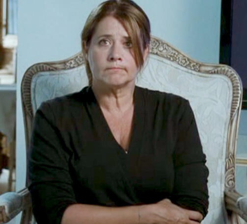 12 Lorraine Bracco sitting in a chair looking pensive, Son of Morning film