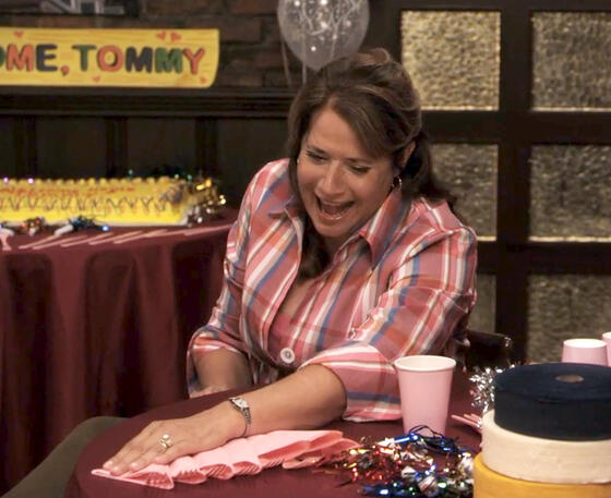 7 Lorraine Bracco as Angela Rizzoli laughing while preparing a birthday party in Rizzoli and Isles.