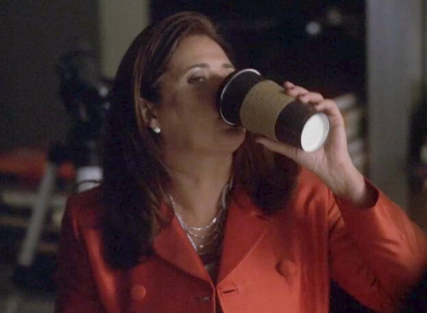 i Lorraine Bracco drinks coffee in a red blazer on Lipstick Jungle.