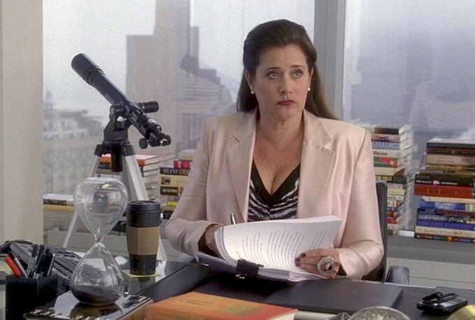 here’s Lorraine Bracco at an office desk looking up judgingly on Lipstick Jungle.