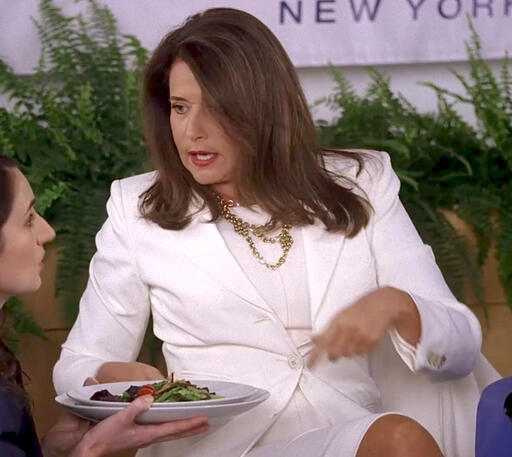 my Lorraine Bracco wearing a white suit at a luncheon on Lipstick Jungle.