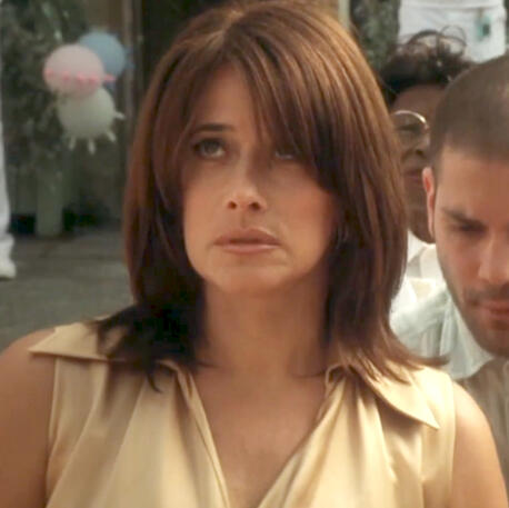 7 Close-up of Lorraine Bracco in a gold dress at the wedding of her son rolling her eyes in Crazy for Love.