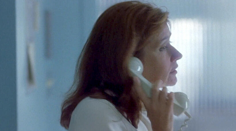 6 Profile shot of Lorraine Bracco talking on the phone in Tangled.