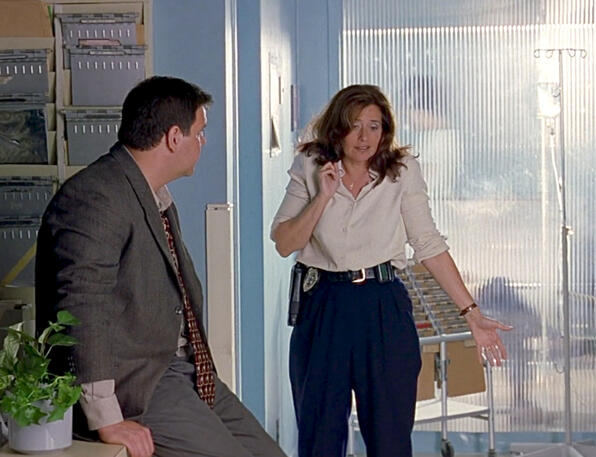 4 Lorraine Bracco shrugging at a man, from Tangled.