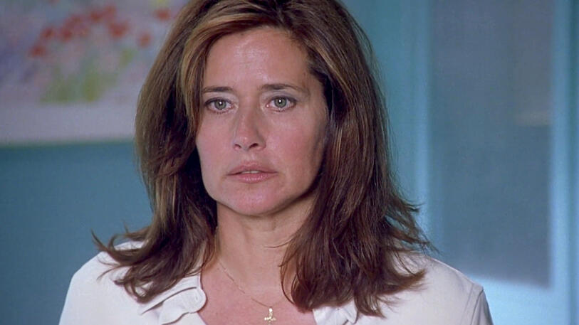 10 Close-up of Lorraine Bracco with a serious expression in the film Tangled.