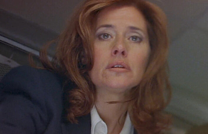 11 Low-angle close-up of Lorraine Bracco looking down at the camera, in movie Tangled.
