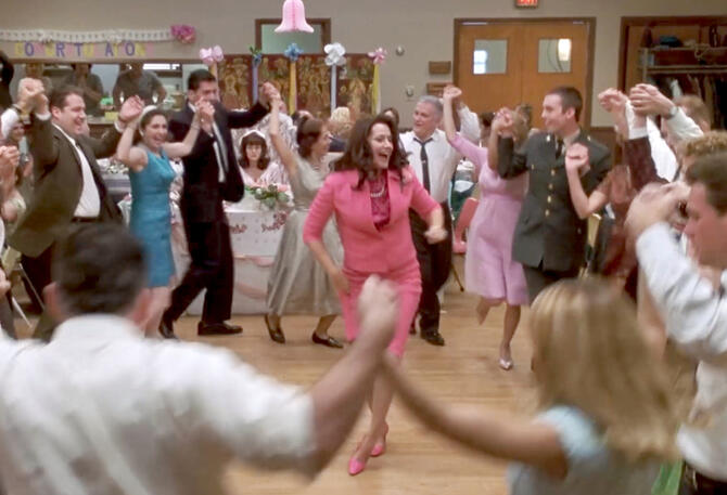 7 Lorraine Bracco dancing in a pink dress at a wedding party in Riding in Cars with Boys.