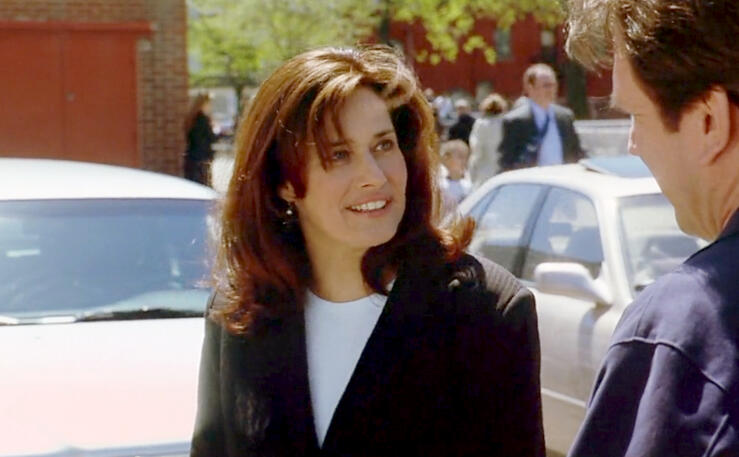 12 Lorraine Bracco smiling outdoors in a black blazer in Custody of the Heart movie.