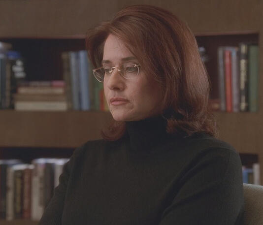 11 Dr. Jennifer Melfi looking somber in a black turtleneck in The Sopranos.