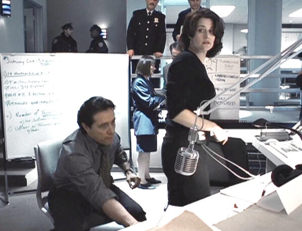 4 Lorraine Bracco and Edward James Olmos in a train command centre in The Taking of Pelham 1 2 3.
