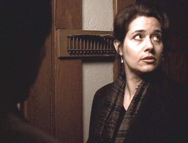 5 Lorraine Bracco in a conversation by a door in The Taking of Pelham 1 2 3.