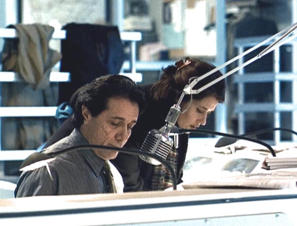 7 Edward James Olmos and Lorraine Bracco looking at down at the control room desk in The Taking of Pelham 1 2 3.