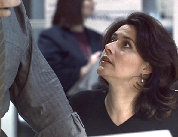 11 Lorraine Bracco looking up curiously at Edward James Olmos in a Taking of Pelham 1 2 3