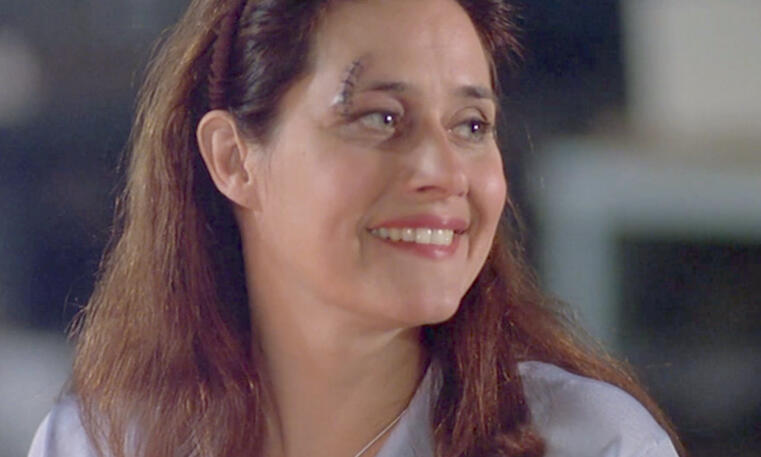 10 Lorraine Bracco smiling with a cut on her forehead in Silent Cradle.