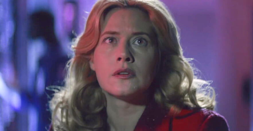 6 Intense close-up of Lorraine Bracco looking up anxiously in the film Hackers.