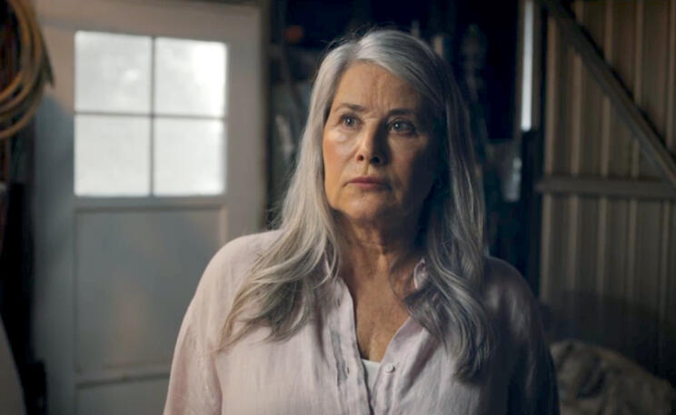 1 Lorraine Bracco with grey hair looking angry in movie The Mother, the Menacer, and Me.