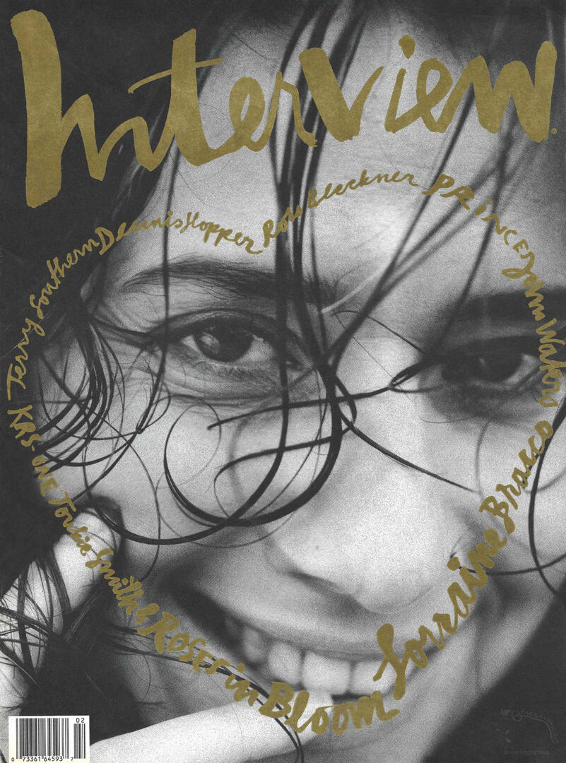 Black and white Interview magazine cover featuring a close-up of actress Lorraine Bracco smiling, overlaid with gold handwriting.
