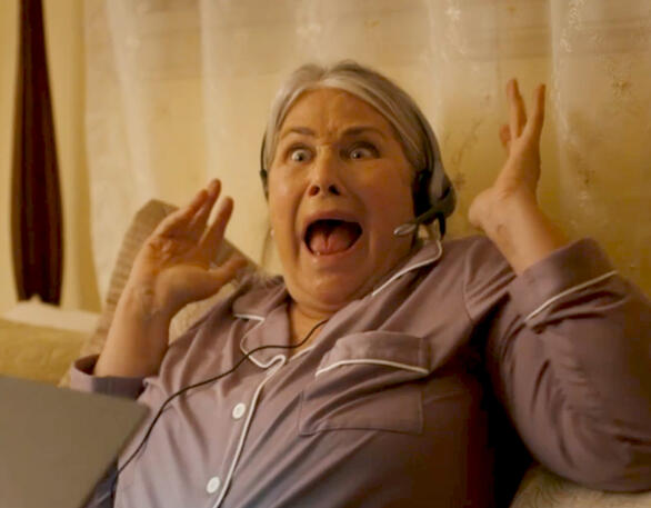 10 Lorraine Bracco screaming in shock wearing a headset in The Mother, the Menacer, and Me.