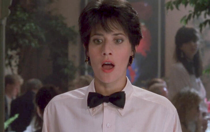 3 Lorraine Bracco looking surprised in a white shirt from The Dream Team.