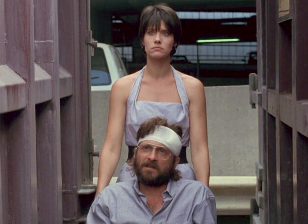 4 Lorraine Bracco looking angry pushing Dennis Boutsikaris in The Dream Team.