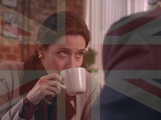 4 Lorraine Bracco sipping from a white mug with a meme union jack overlay, from the film Getting Gotti.