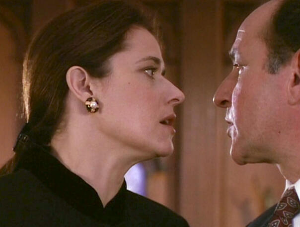 6 Lorraine Bracco in a tense face-to-face confrontation with a man in a scene from Getting Gotti.