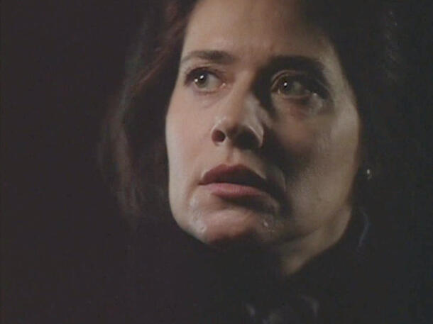 7 Close-up of Lorraine Bracco looking up anxiously in a scene from Getting Gotti.