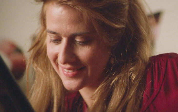 5 Close-up of Lorraine Bracco smiling softly with warm, natural lighting in the film Radio Flyer.