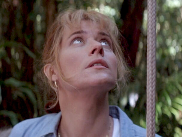 3 Lorraine Bracco looking upward at a jungle canopy, Medicine Man film scene.