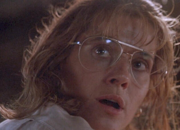 5 Close-up of Lorraine Bracco with glasses looking shocked in Medicine Man movie.