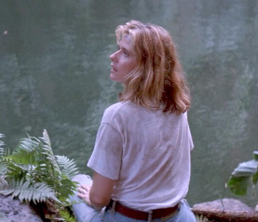 9 Lorraine Bracco near a body of water shot from behind looking up in Medicine Man