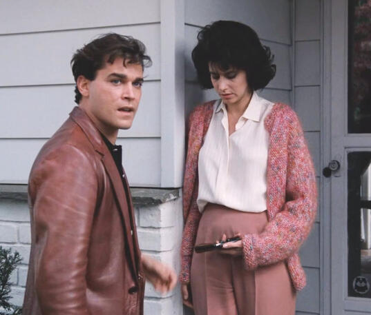 10 Ray Liotta and Lorraine Bracco standing outside Karen's house, while she holds his gun.