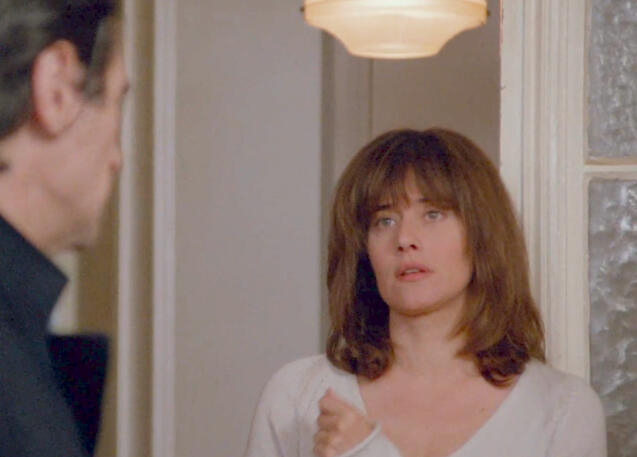 9 Lorraine Bracco looking judgemental in a white top in Les Menteurs