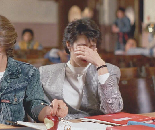 5 Actress Lorraine Bracco covering her face facepalming during a performance scene in Sing 1989.