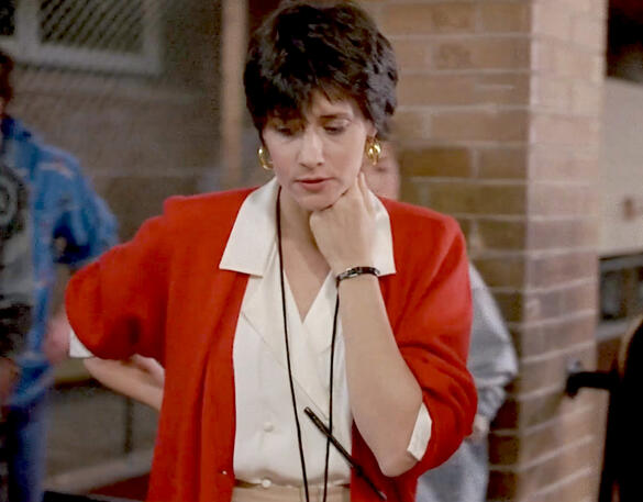 9 Lorraine Bracco in a red cardigan in Sing 1989.