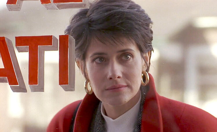 10 Lorraine Bracco close up looking through a window in 1989 film Sing.