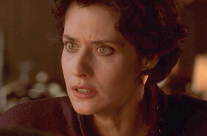 8 Dramatic close-up of Lorraine Bracco looking angry in Someone to Watch Over Me.